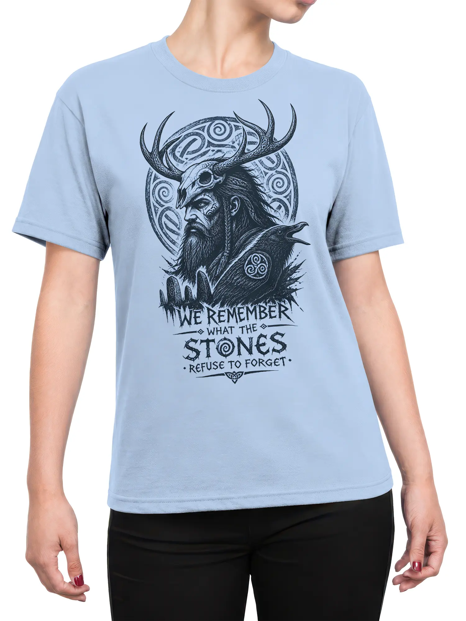Light blue female-fit T-shirt showing a bearded warrior, raven, antlered skull, and symbolic artwork