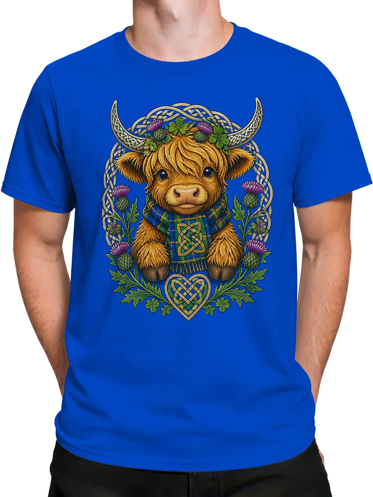 Male torso wearing a blue Highland cow T-shirt with Celtic knotwork, thistles, shamrocks, and tartan details