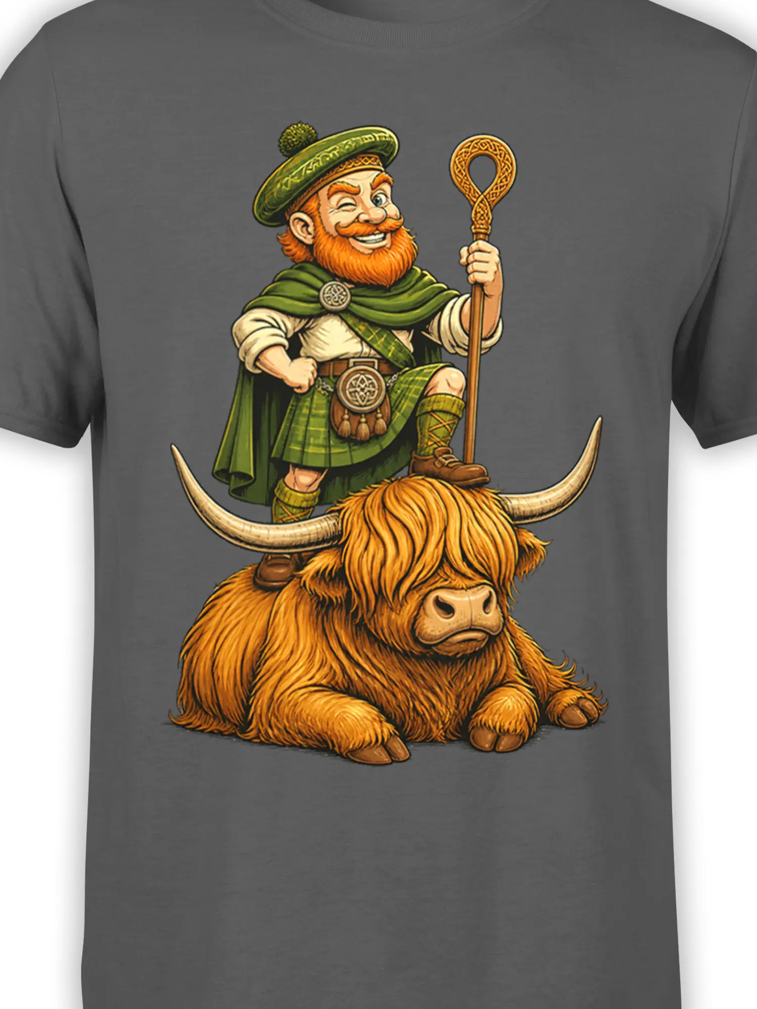 Close-up of Highland cow rider artwork on a gray T-shirt with green Celtic details