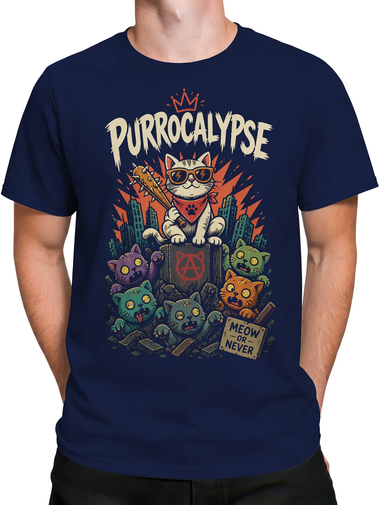 Male torso wearing navy Purrocalypse cat T-shirt with crowned feline, spiked bat, colorful cats, and city rubble