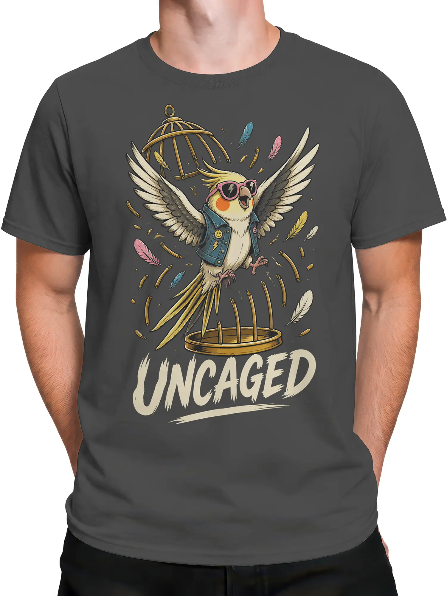 Male torso wearing a gray T-shirt featuring a colorful parrot escaping a golden cage