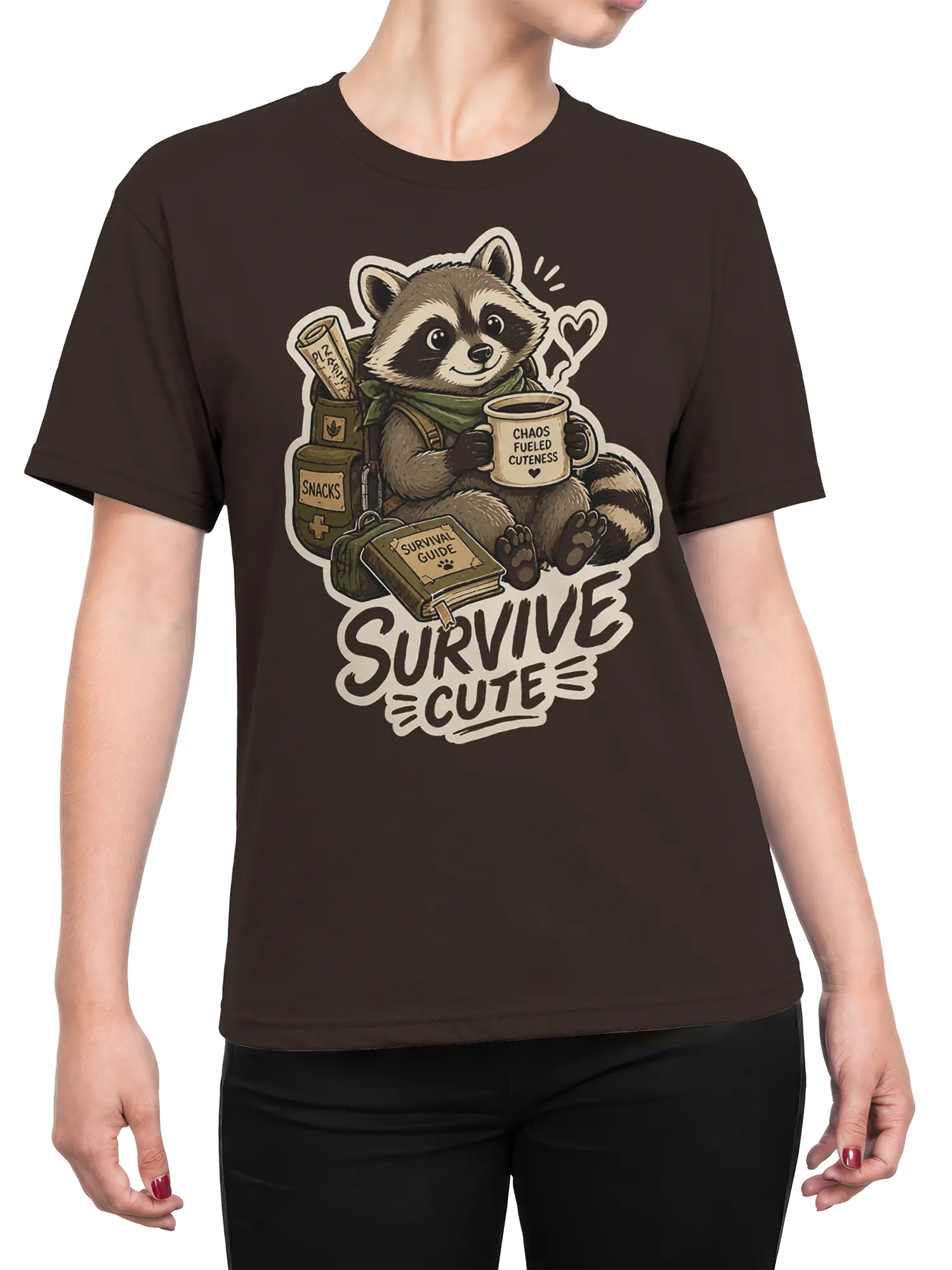 Female torso wearing a brown raccoon T-shirt with coffee, survival gear, snacks, and “SURVIVE CUTE” artwork