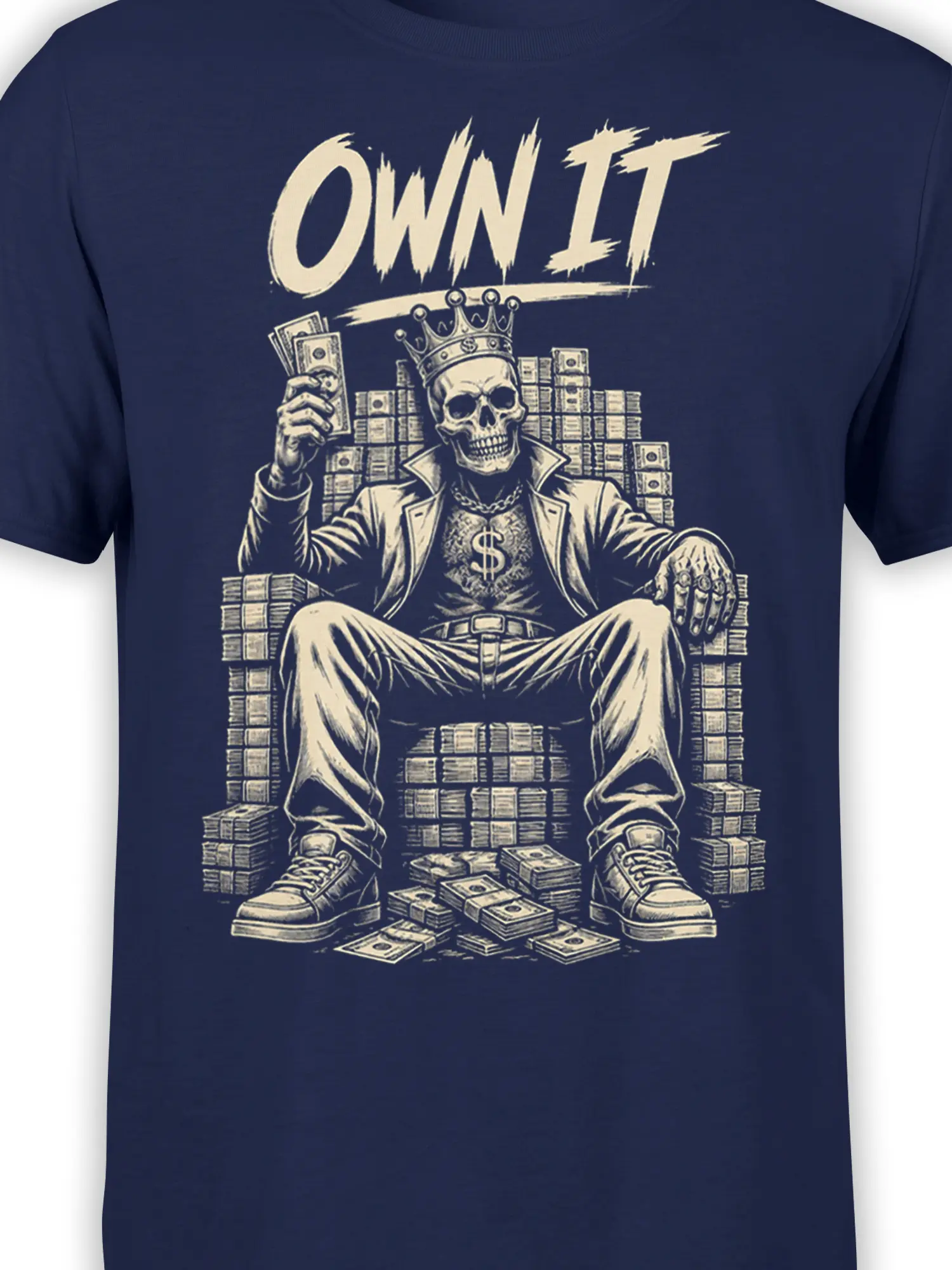 Close-up of crowned skull, dollar sign, cash, and OWN IT design on a navy graphic tee