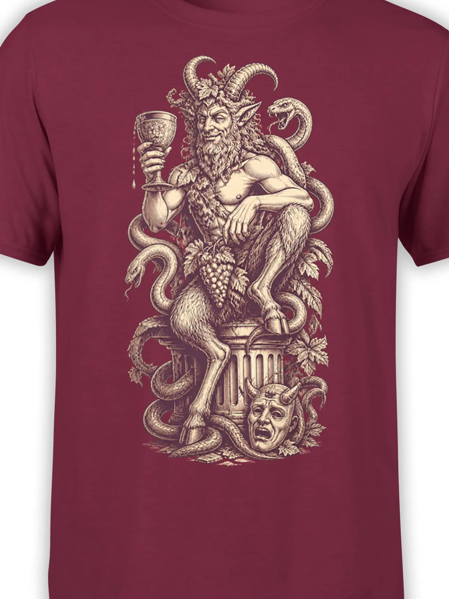 Close-up of horned satyr, snakes, grapes, and goblet artwork on burgundy fabric