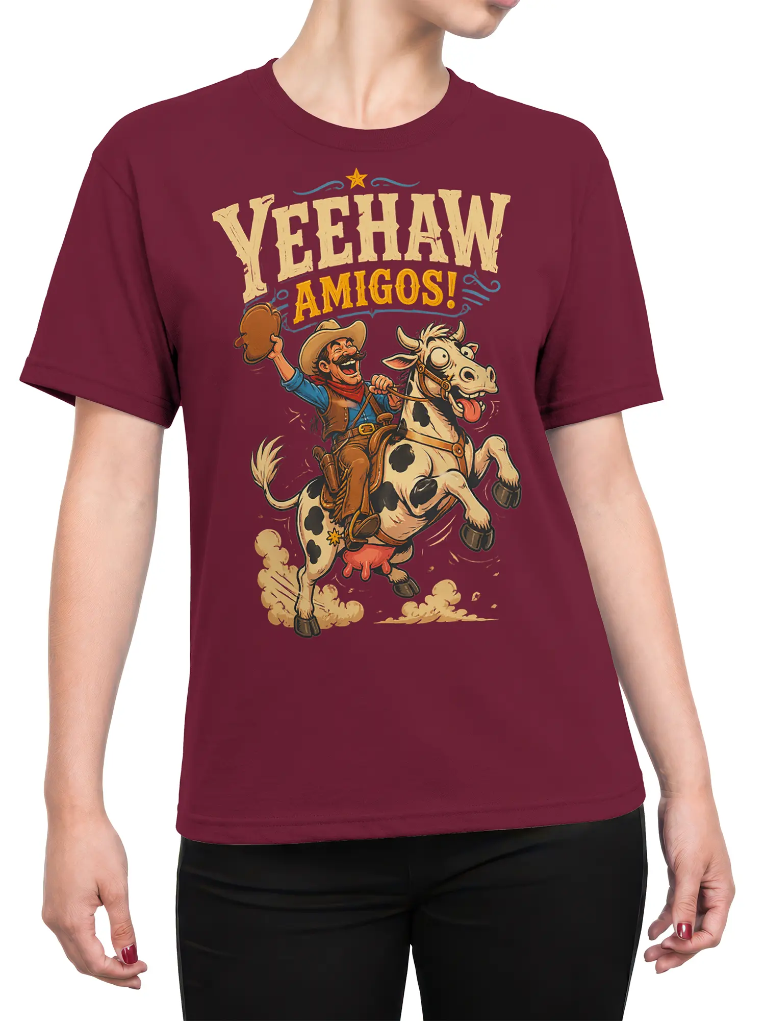 Female torso wearing a burgundy T-shirt with vintage cowboy cow and Yeehaw Amigos artwork