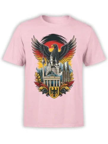 German heritage T-shirt with a black eagle, landmarks, mountains, and gold shield on a pink shirt