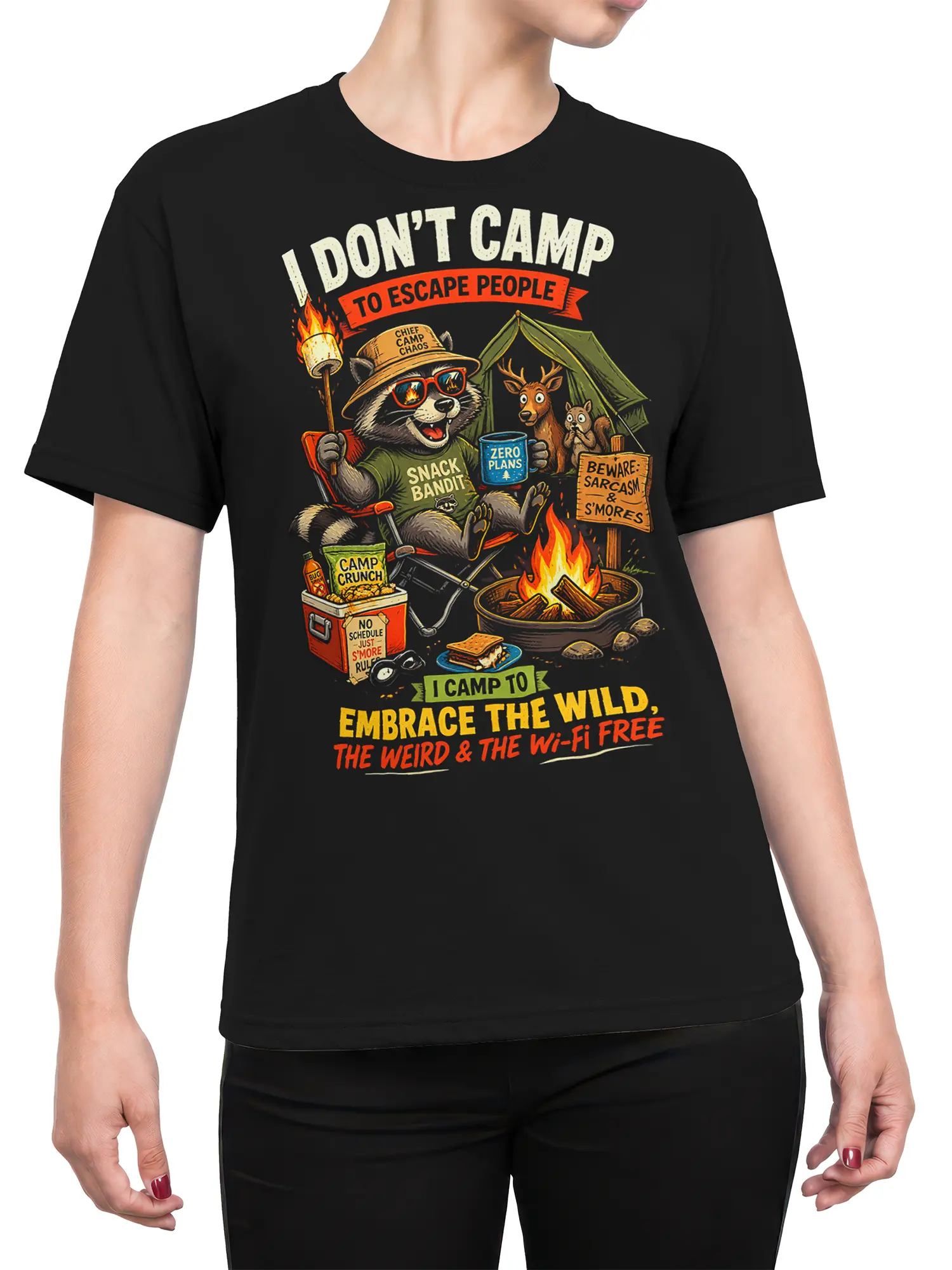 Female torso wearing a black raccoon camping T-shirt with a tent, campfire, snacks, and vintage outdoor artwork
