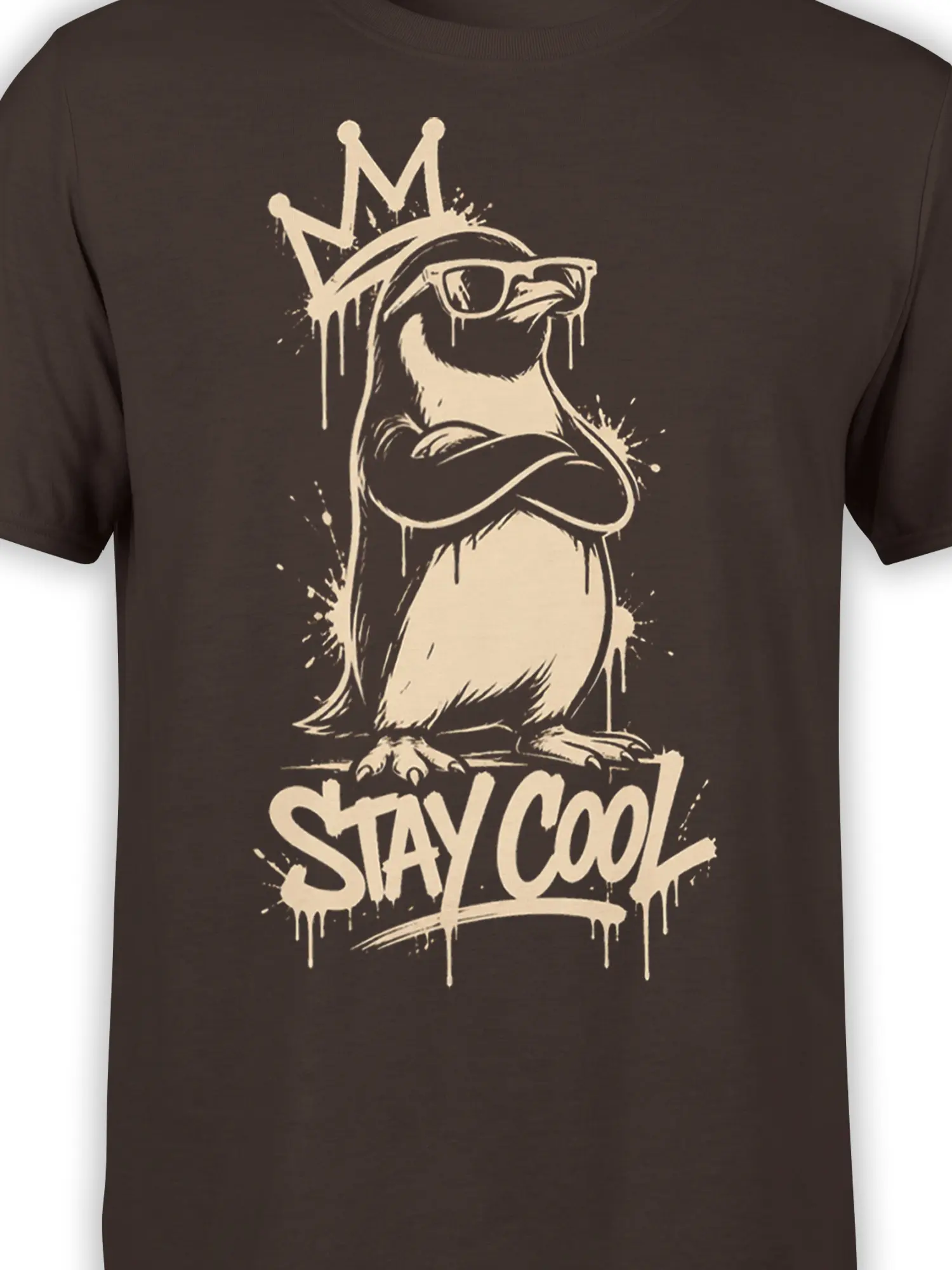 Close-up of crowned sunglasses bird artwork and STAY COOL lettering on a brown T-shirt