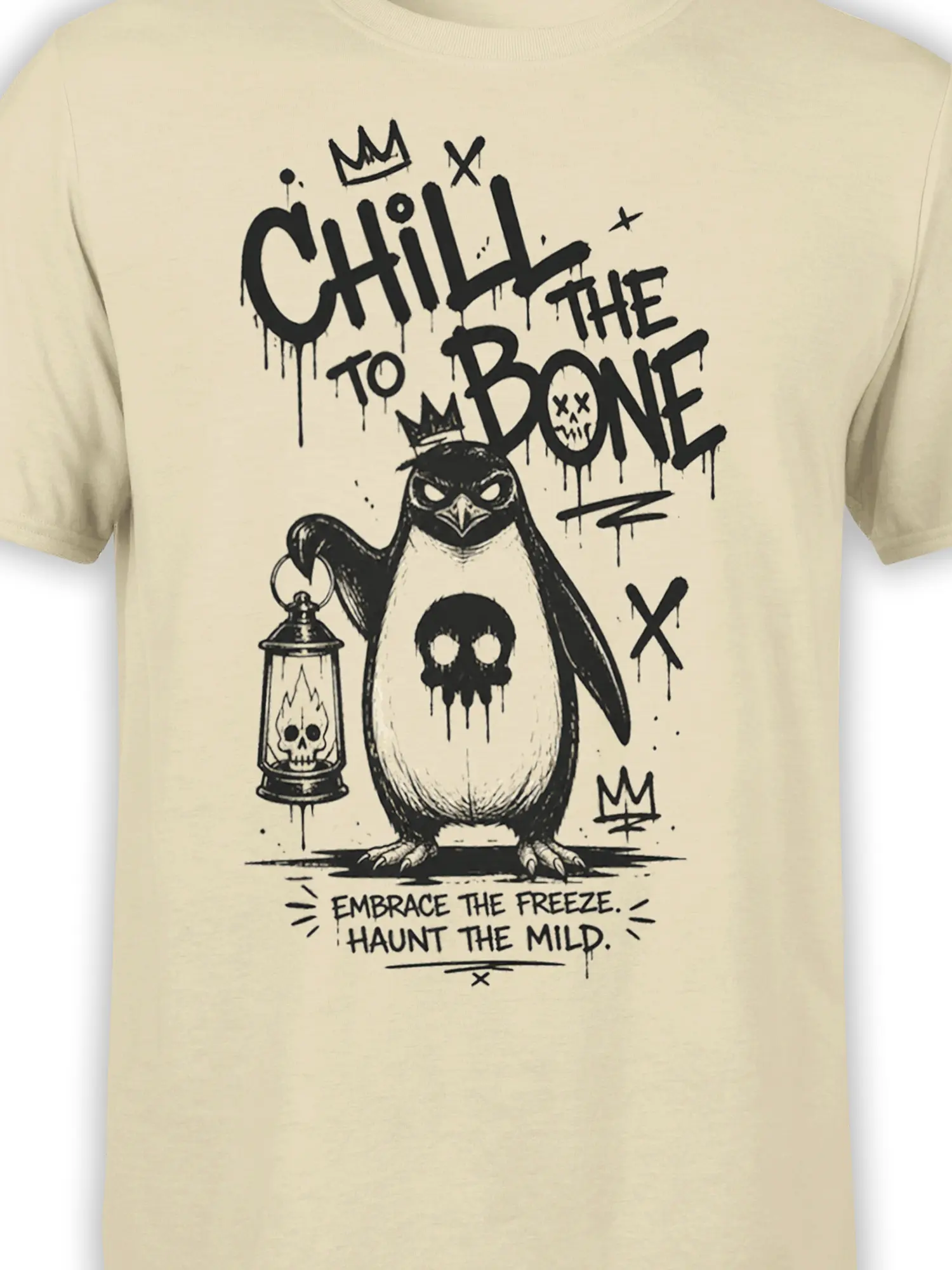 Close-up of crowned penguin artwork, skull lantern, dripping skull, and black gothic lettering on beige fabric