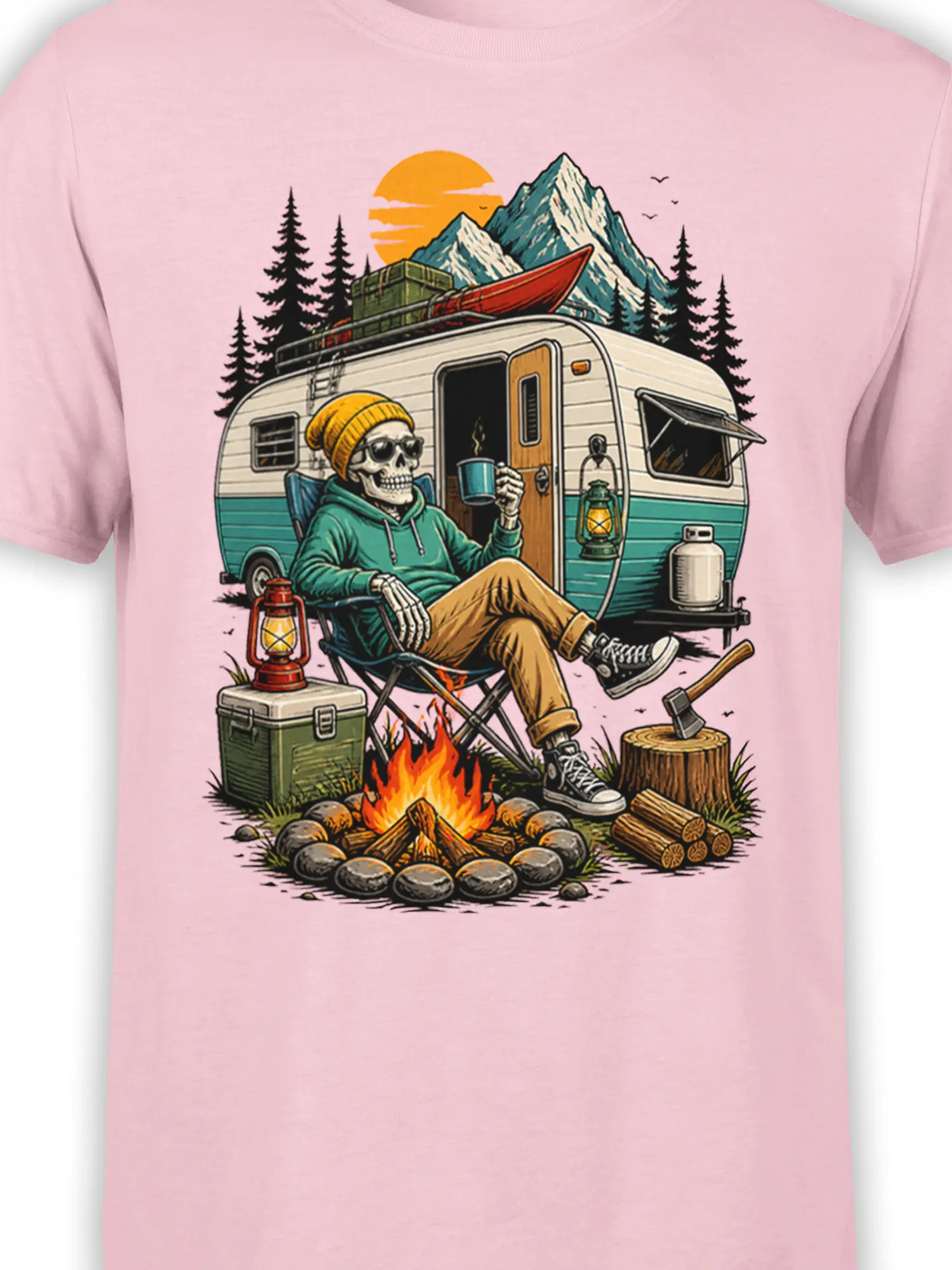 Close-up of skeleton camper artwork with campfire, trailer, canoe, lanterns, and mountains on a pink T-shirt