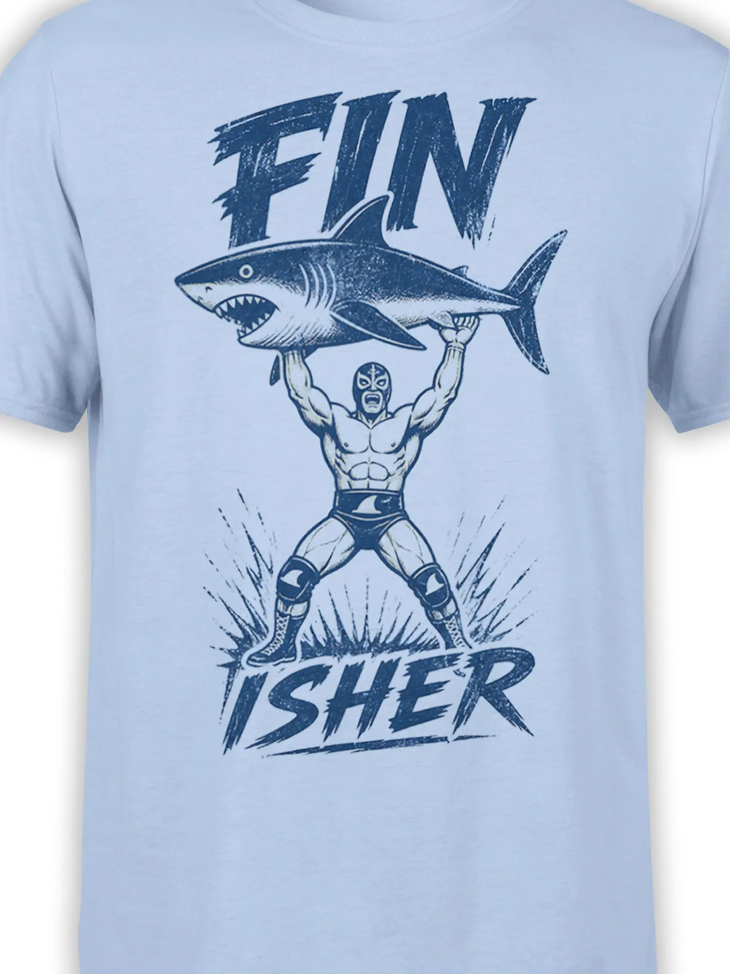 Close-up of masked wrestler and shark artwork printed on a light blue T-shirt