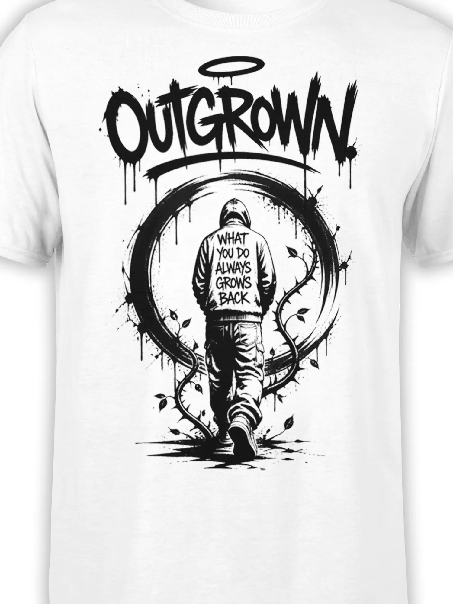 Close-up of the black Outgrow It graphic with hooded figure, halo, vines, leaves, and text on a white T-shirt