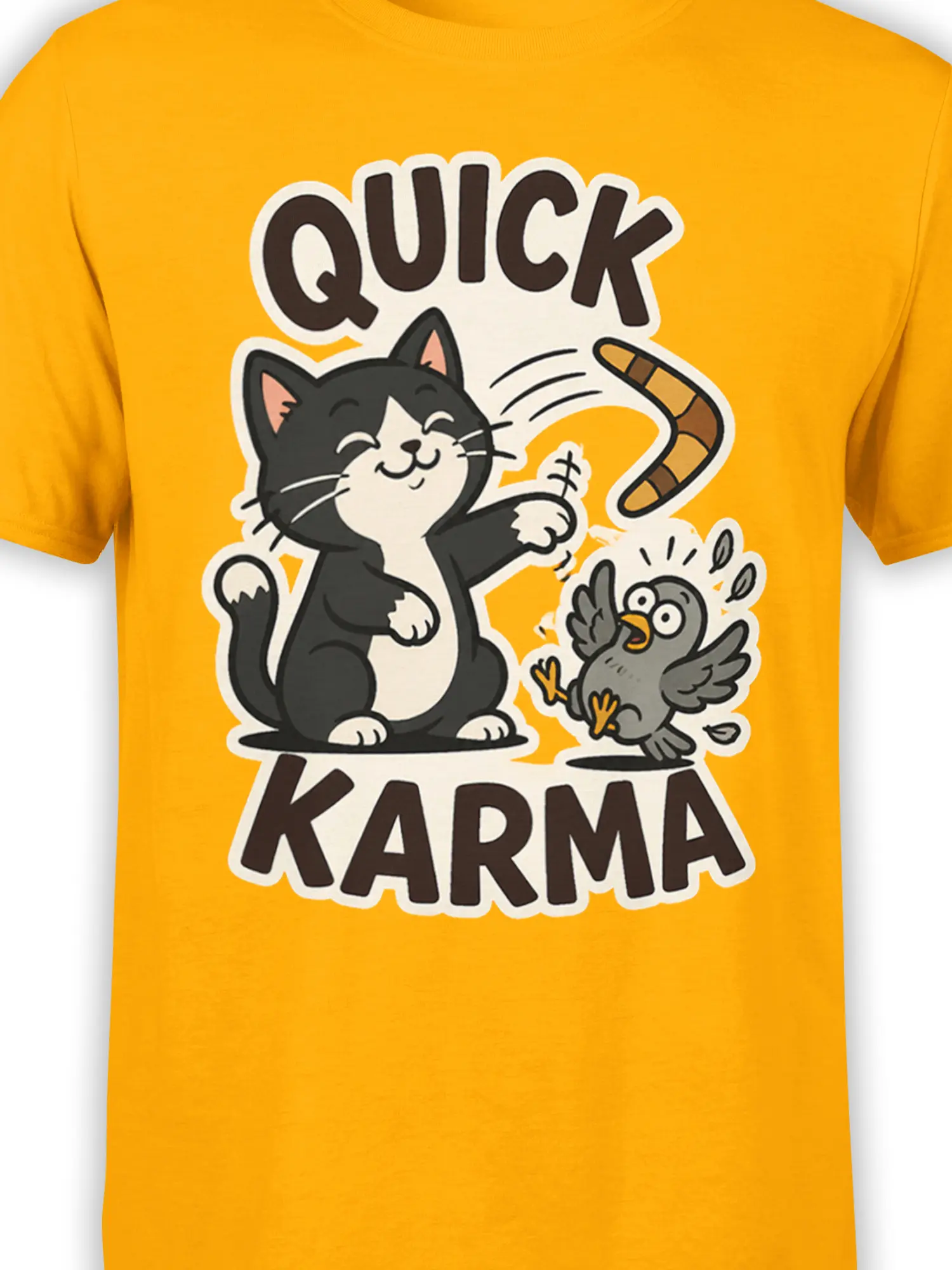 Close-up of black-and-white cat and gray bird Quick Karma artwork on an orange shirt