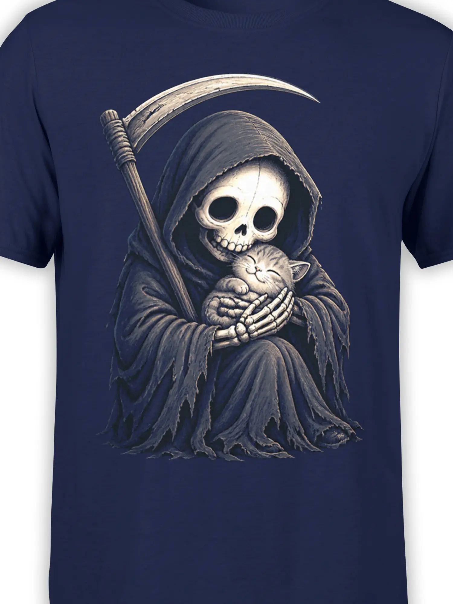 Close-up of a hooded skeleton, sleeping kitten, and scythe printed on a navy T-shirt