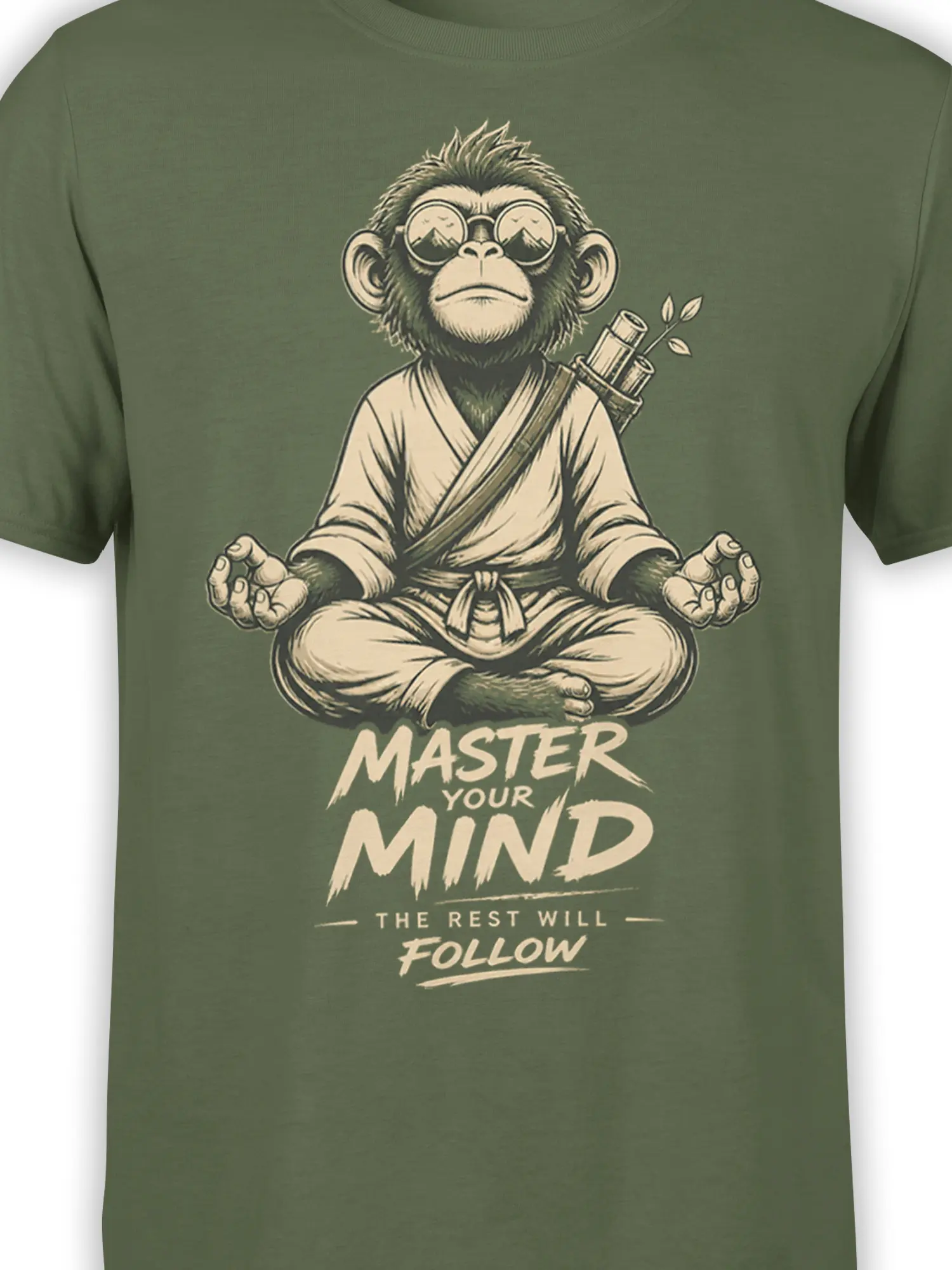 Close-up of meditating monkey artwork and “Master Your Mind” text on a green T-shirt