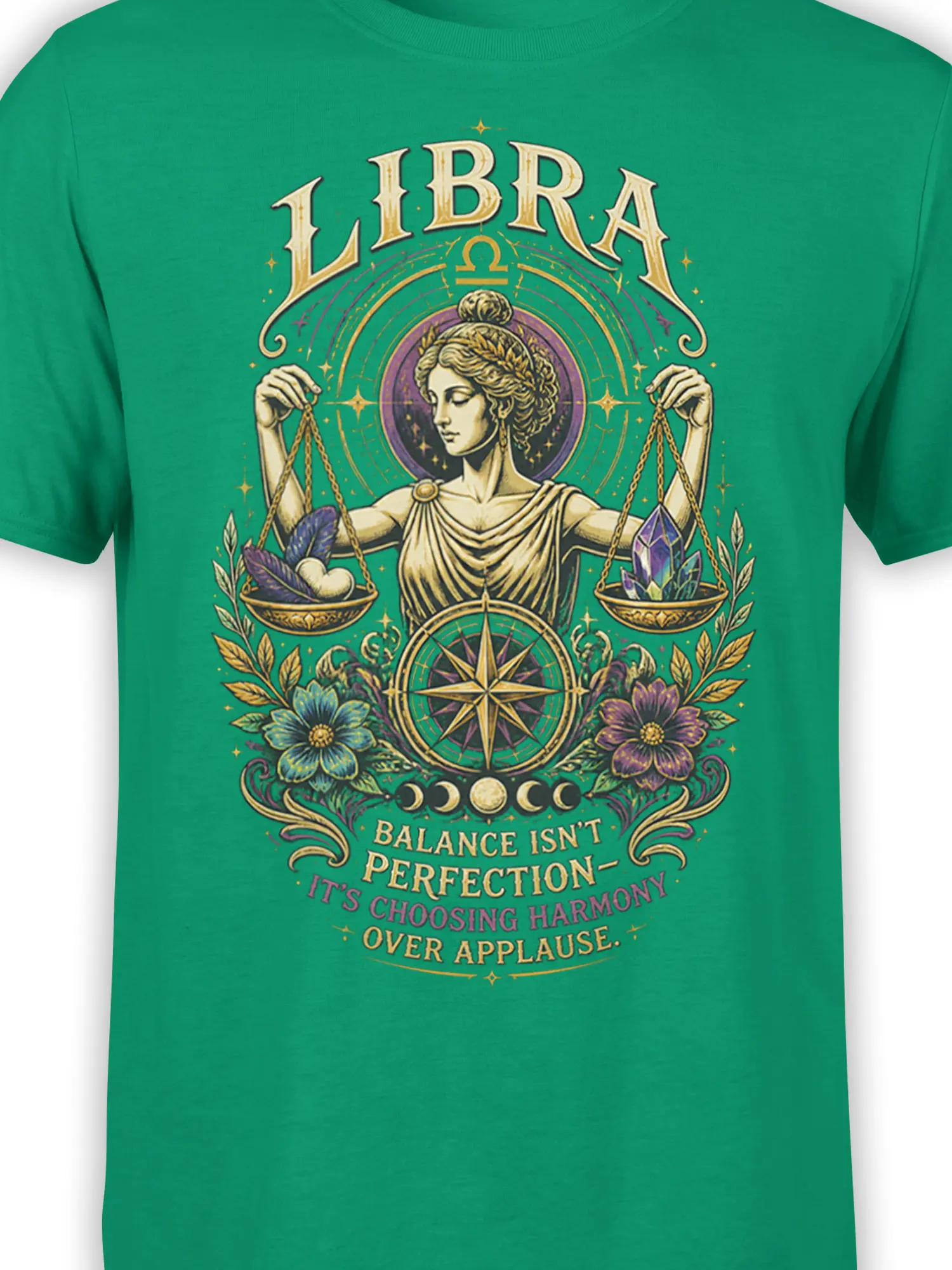 Close-up of green Libra T-shirt artwork with a woman, scales, crystals, flowers, and zodiac details