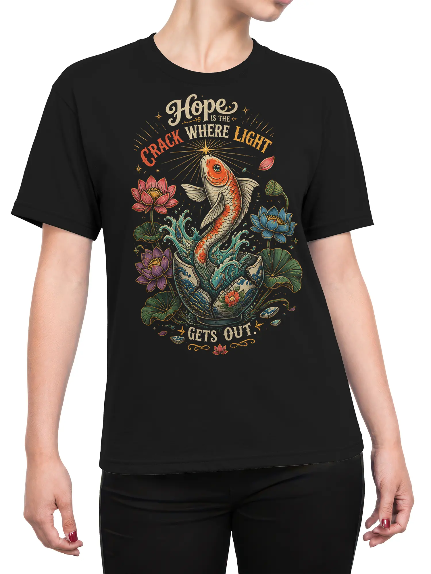 Female torso wearing a black koi fish T-shirt with lotus flowers, water, and a colorful hopeful graphic