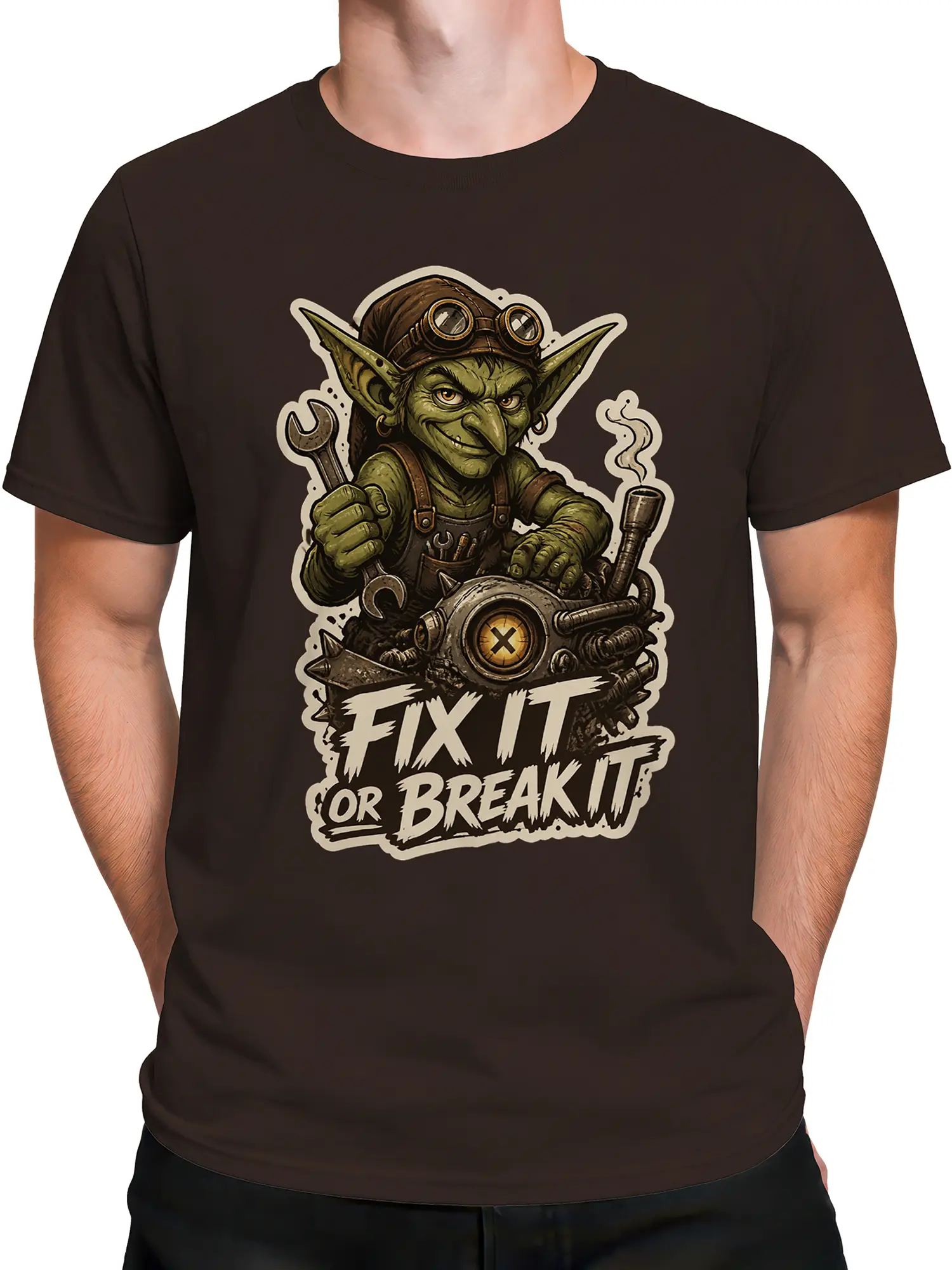 Male torso wearing a dark brown T-shirt with green goblin mechanic artwork and “Fix It or Break It” text