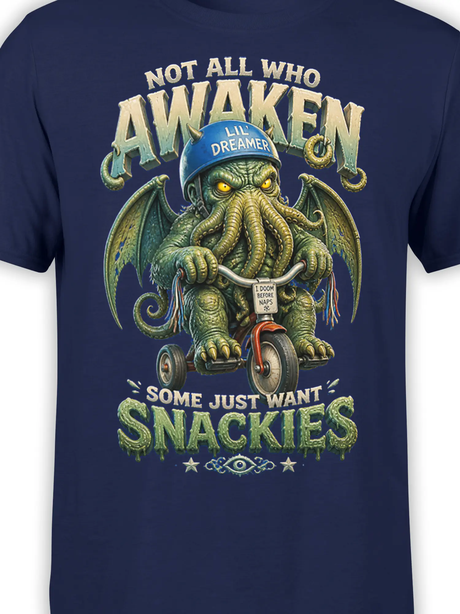 Close-up of the winged tentacled monster and vintage snack lettering printed on a navy fantasy T-shirt