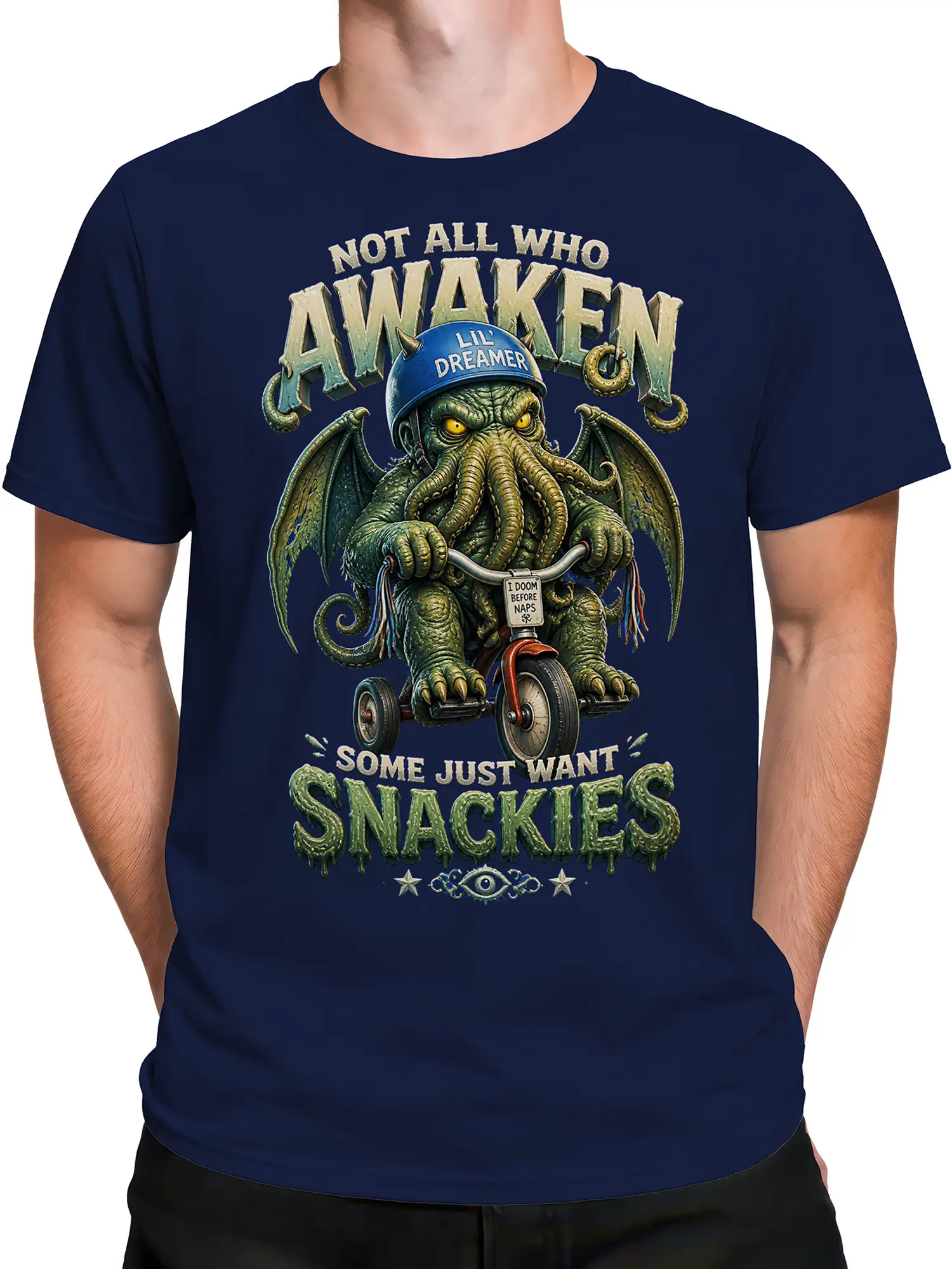 Male torso wearing a navy fantasy T-shirt with a winged monster, tentacles, and humorous nap and snack text