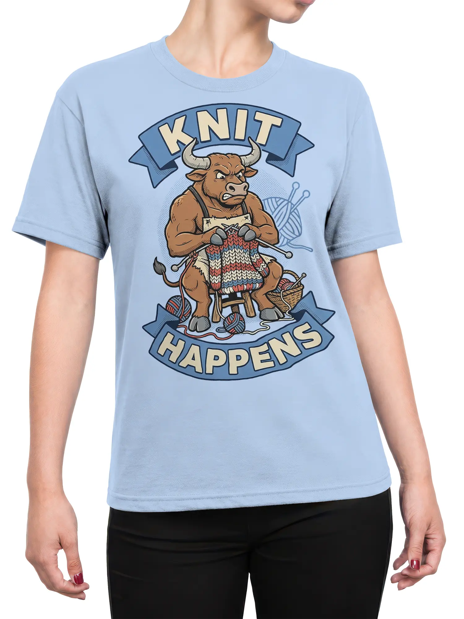 Female torso wearing a light blue bull knitting T-shirt with colorful yarn and “Knit Happens” artwork