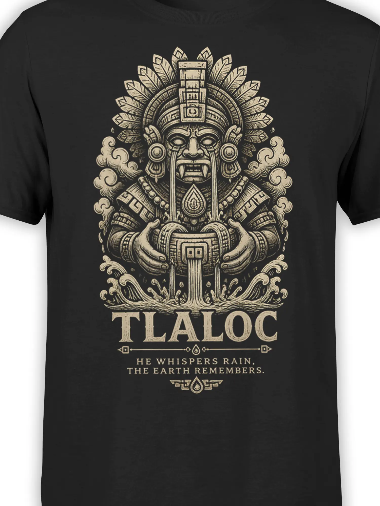 Close-up of Tlaloc rain deity artwork with feathered headdress, water vessel, symbols, and cream lettering on black fabric