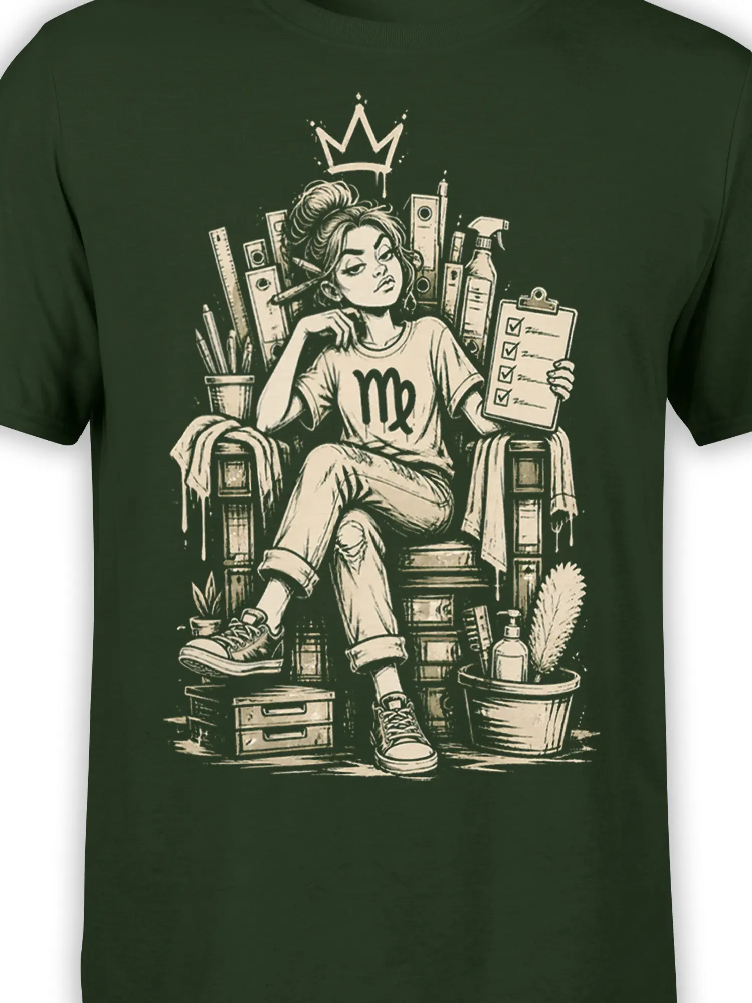 Close-up of crowned Virgo zodiac artwork with beauty tools on a dark green T-shirt