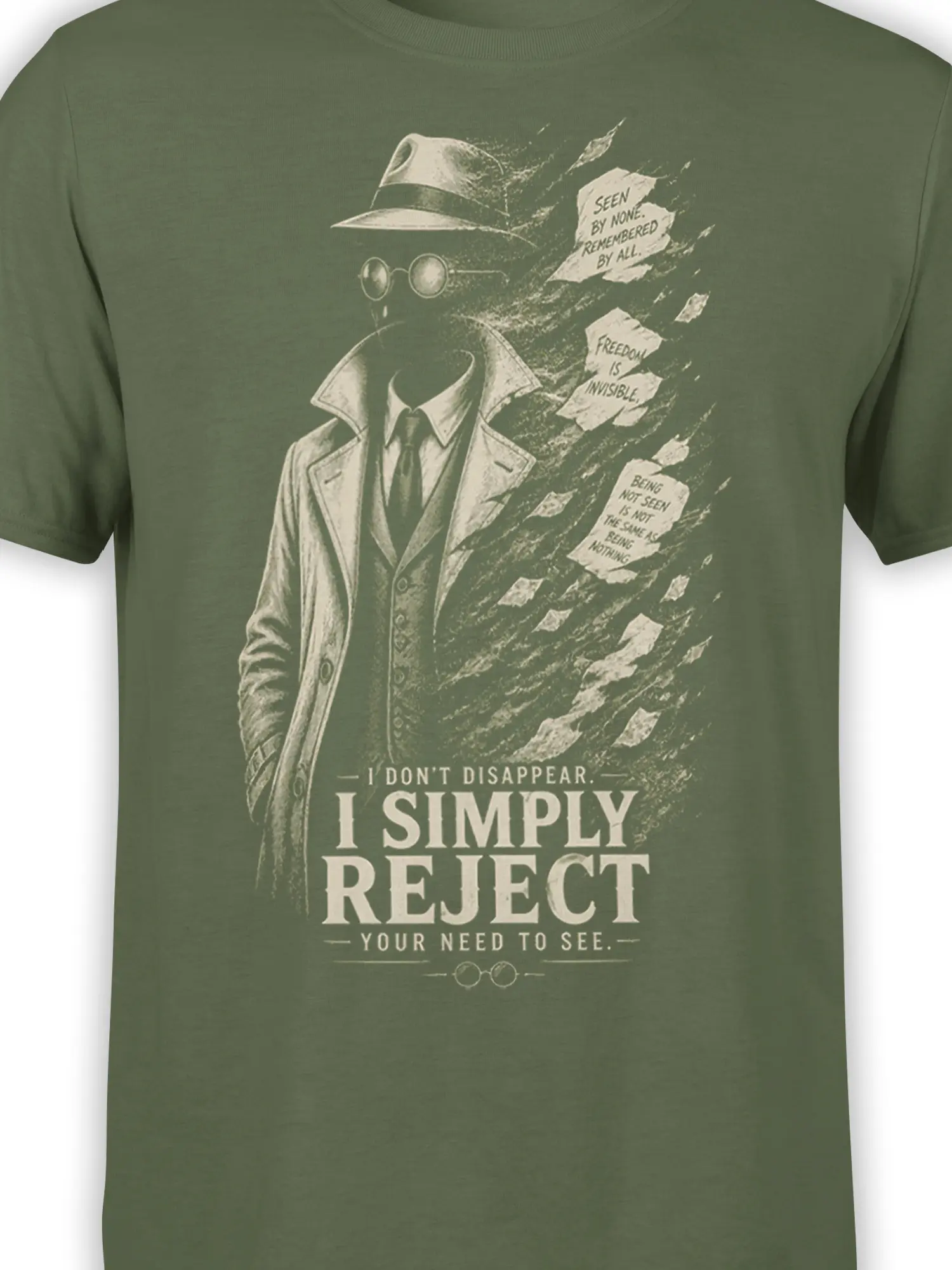 Close-up of vintage detective artwork, torn-paper details, and bold text on a green graphic T-shirt
