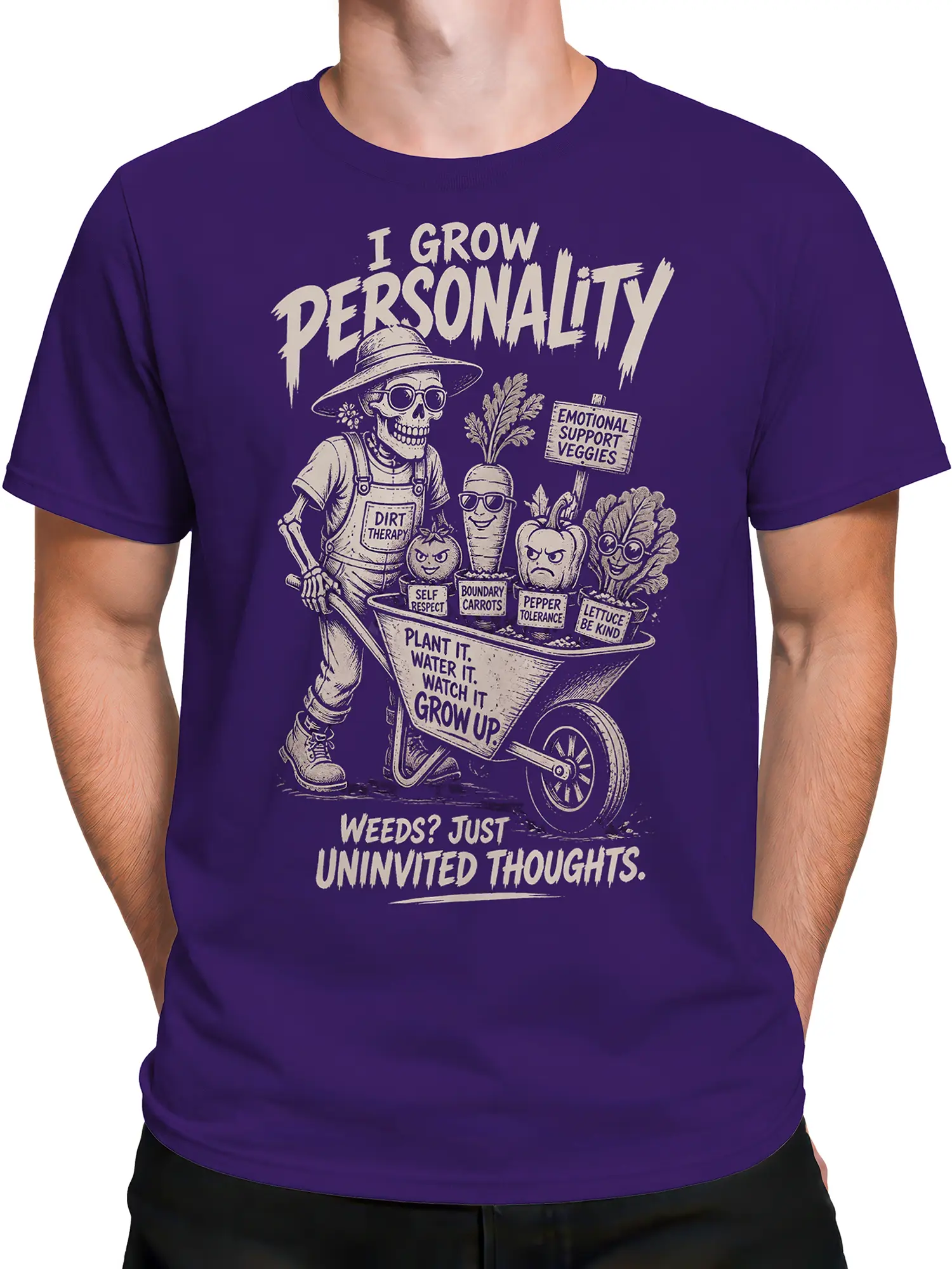 Male torso wearing a purple skeleton gardener T-shirt with vegetable characters and dirt therapy artwork