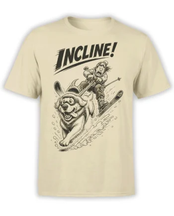 Beige dog skiing T-shirt with a goggle-wearing pup, skier, snow spray, and bold “INCLINE!” lettering