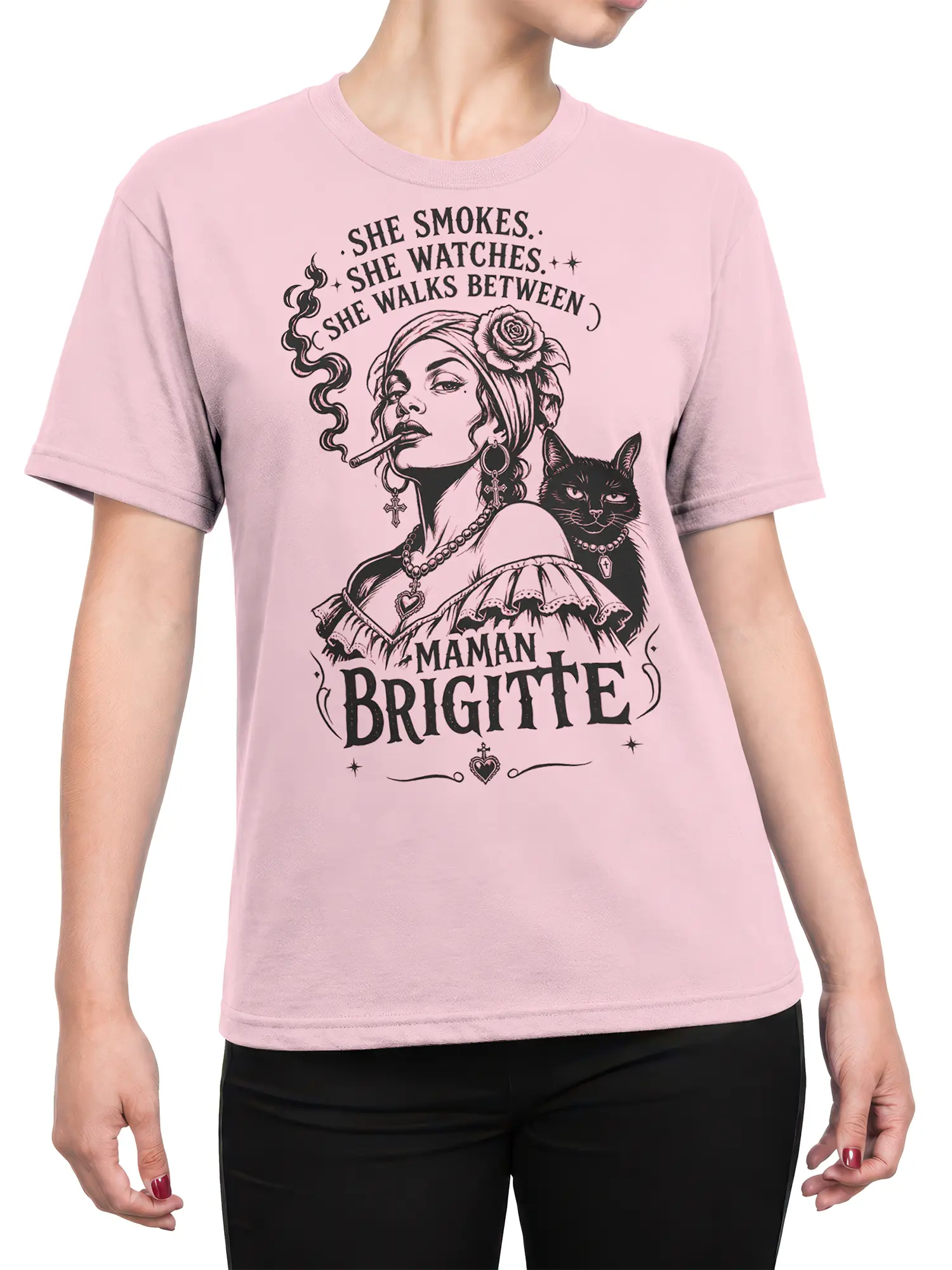 Female torso wearing a pink Maman Brigitte shirt with a smoky woman and black cat graphic