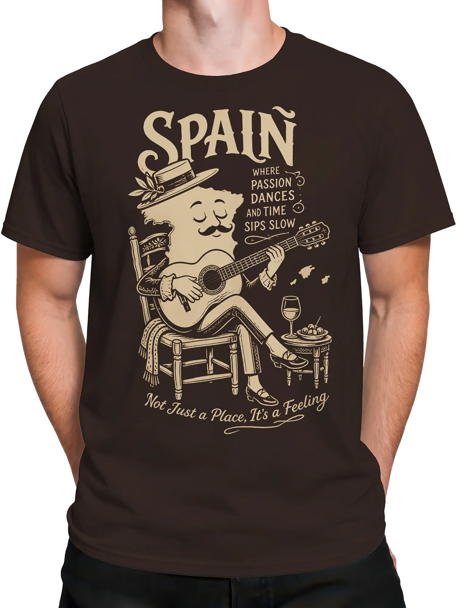 Male torso wearing a brown Spain T-shirt with mustached guitarist and vintage cream artwork
