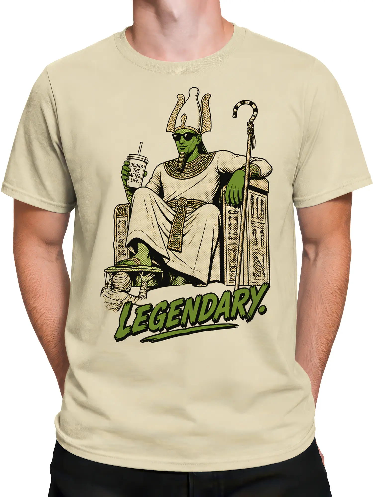 Male torso wearing a beige Egyptian-inspired pharaoh T-shirt with throne and “LEGENDARY.” graphic