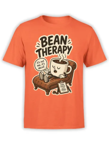 Orange Bean Therapy coffee T-shirt with a sleepy cup on a chaise and a more coffee less drama message