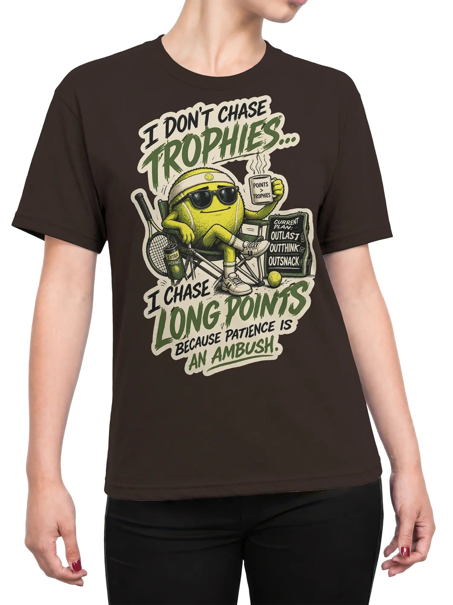 Female torso wearing a brown tennis T-shirt with a humorous tennis ball character and long points design