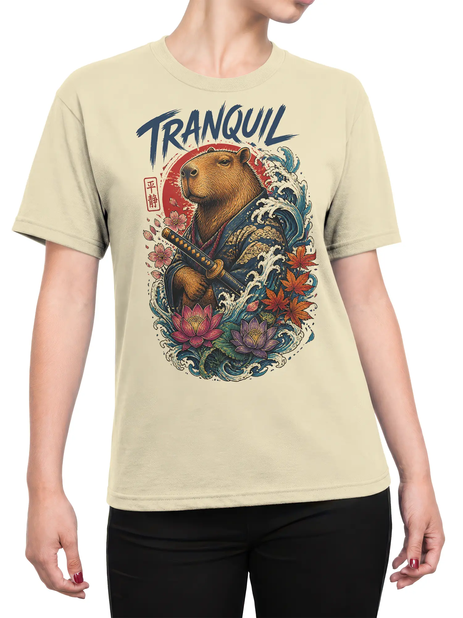 Female torso wearing a beige capybara warrior T-shirt with waves, lotus flowers, blossoms, and a katana