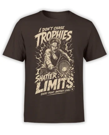 Brown tennis T-shirt with intense player, racket, cracked court artwork, and bold cream “Shatter Limits” text