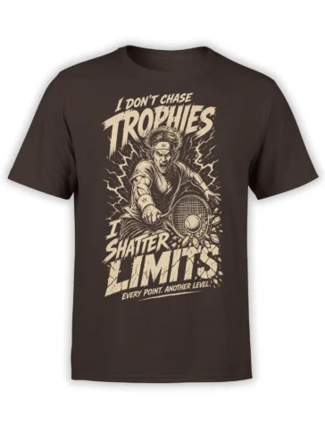 Brown tennis T-shirt with intense player, racket, cracked court artwork, and bold cream “Shatter Limits” text