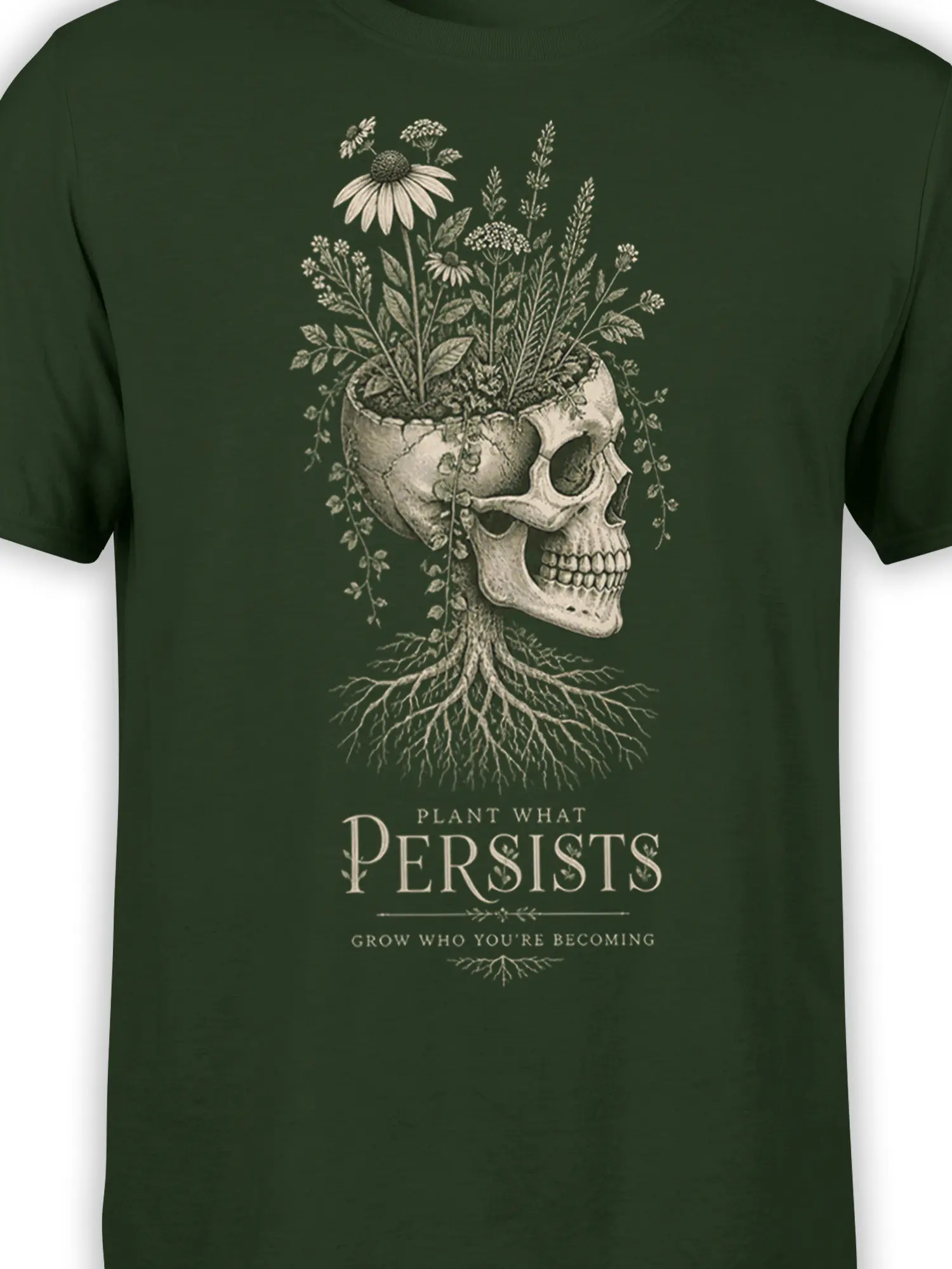 Close-up of botanical skull artwork with flowers and roots on a green graphic T-shirt