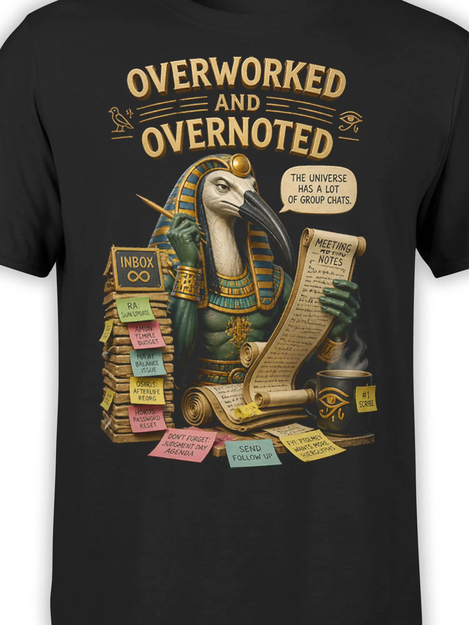 Close-up of black Egyptian graphic tee showing ibis-headed figure, golden lettering, sticky notes, and meeting scroll
