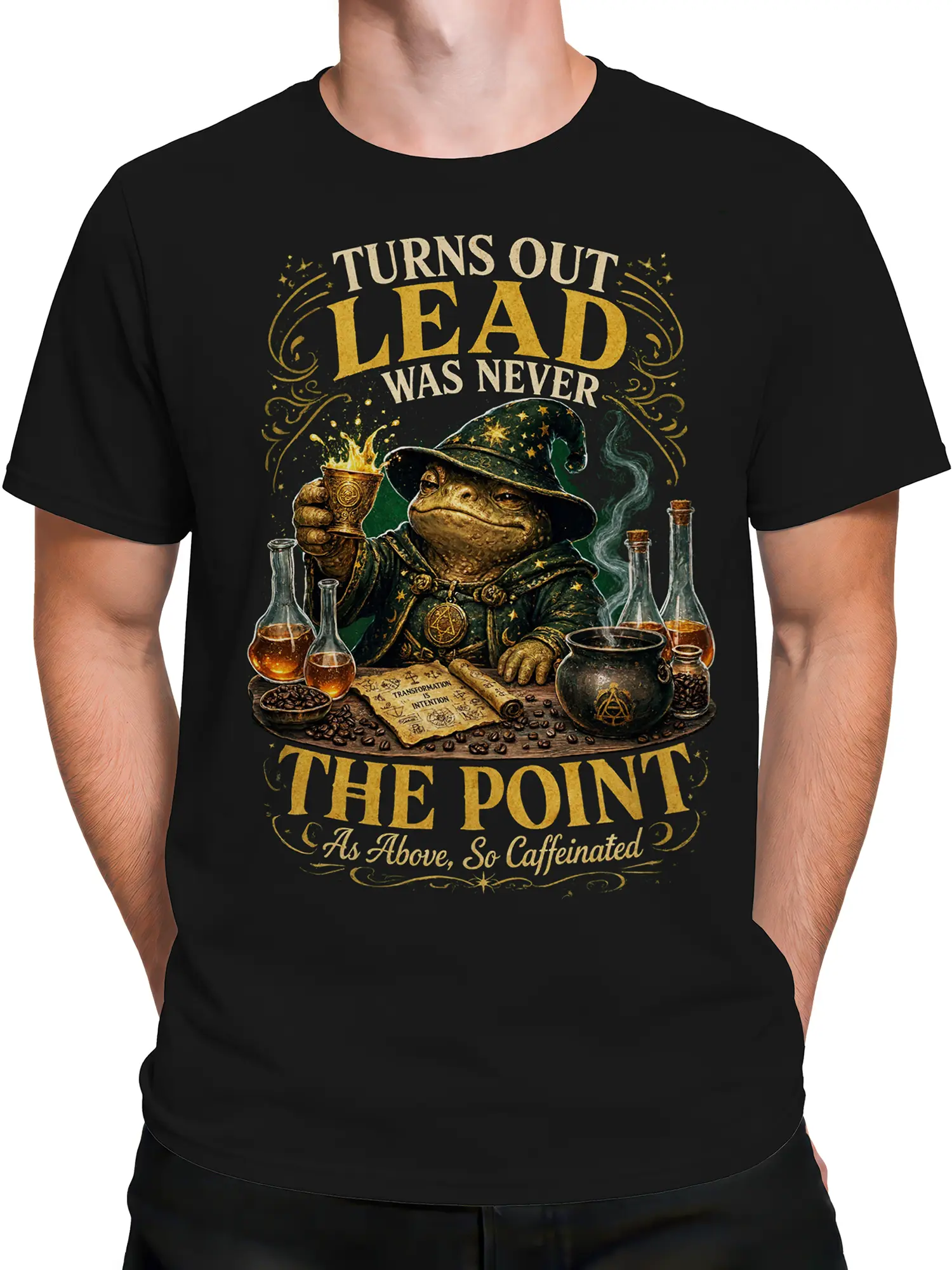 Male torso wearing a black wizard frog coffee shirt with potion bottles and gold fantasy artwork