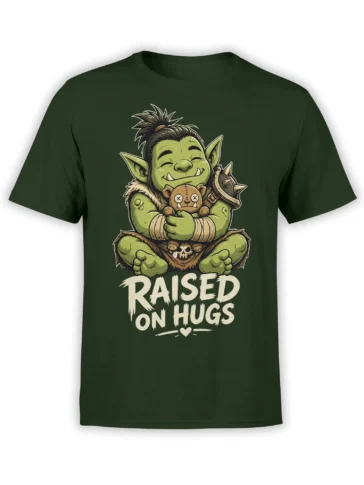 Dark green shirt with a smiling green goblin hugging a stitched teddy bear and “RAISED ON HUGS” text