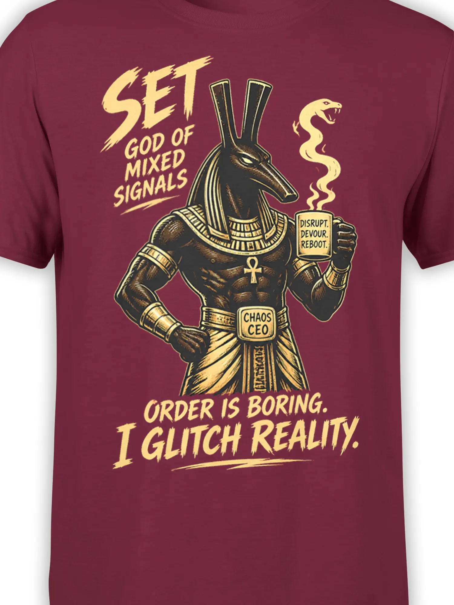 Close-up of Egyptian jackal god artwork and chaos lettering on a burgundy graphic T-shirt