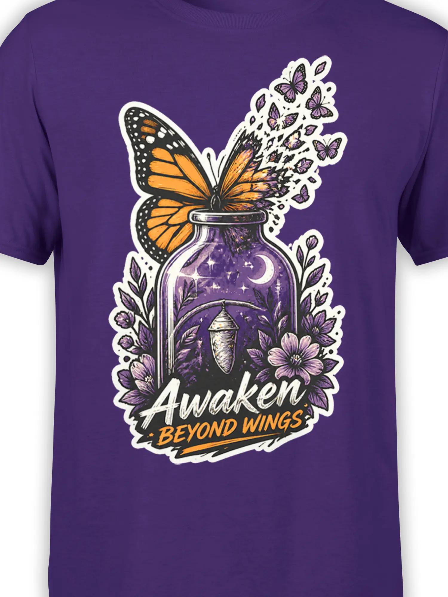 Close-up of orange butterfly and starry potion bottle artwork on a purple graphic tee