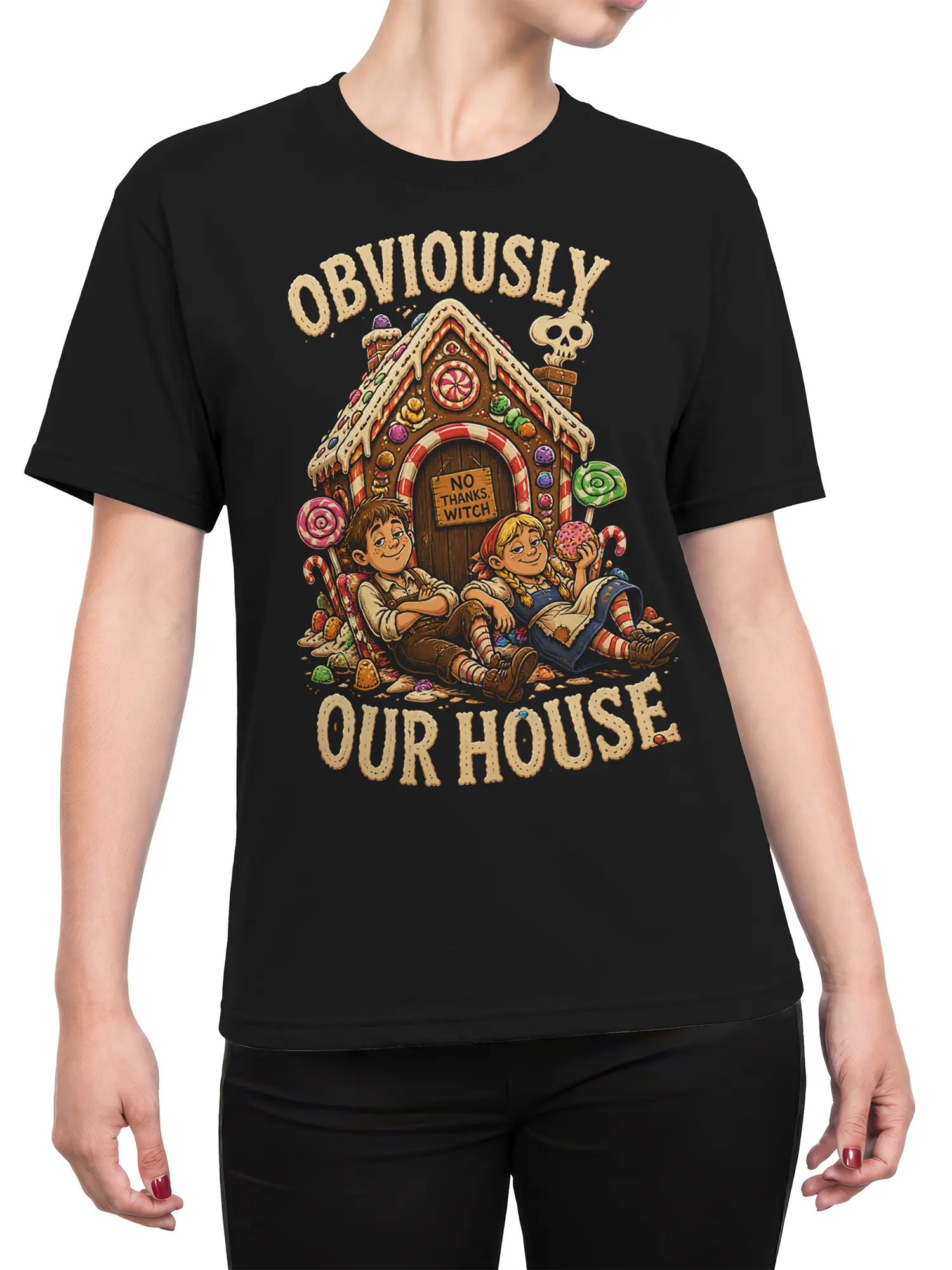 Female torso wearing a black T-shirt with a colorful gingerbread house, children, candy, and witch warning graphic