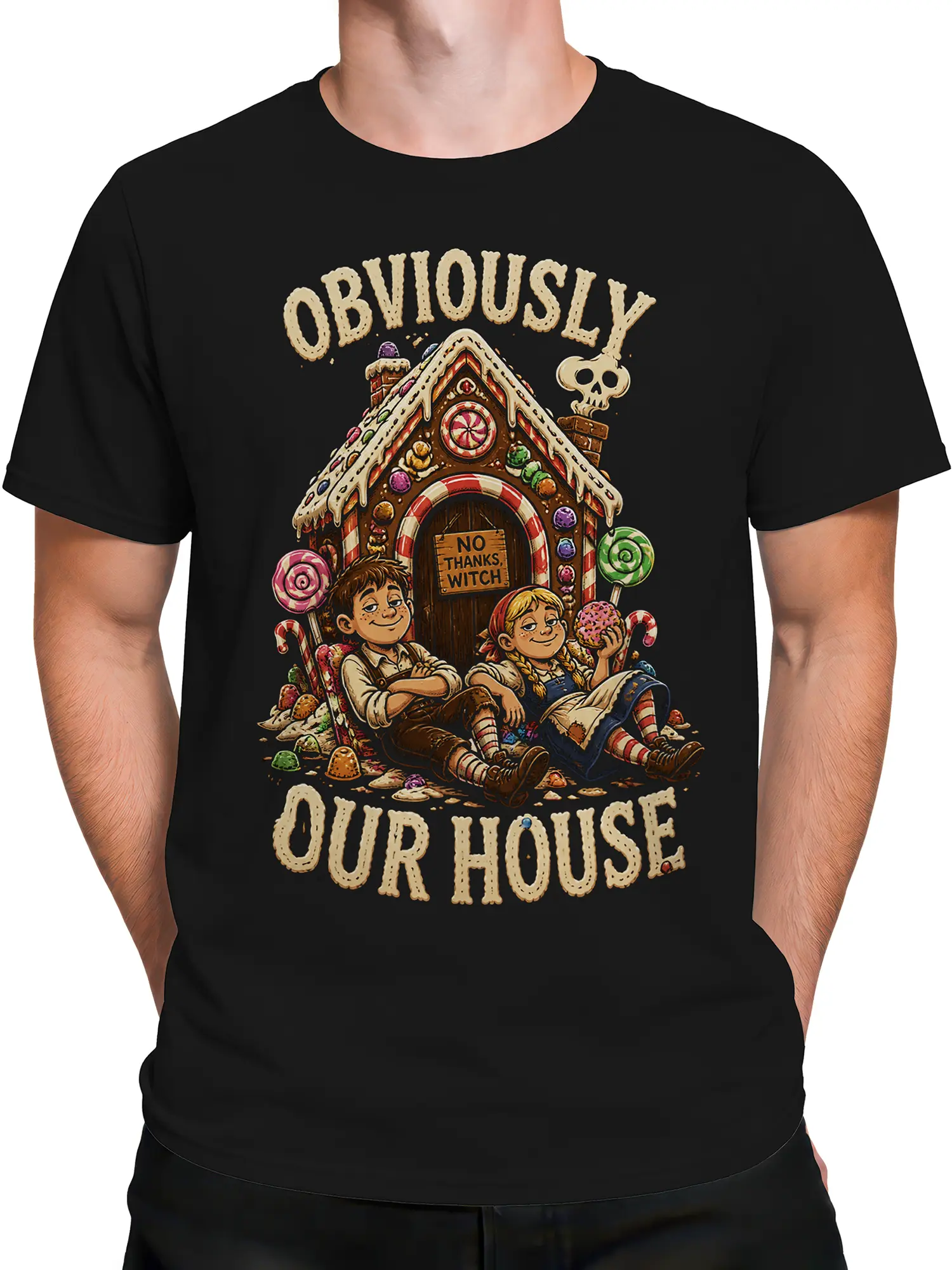 Male torso wearing a black fantasy T-shirt with a candy house, children, sweets, and “No Thanks, Witch” artwork