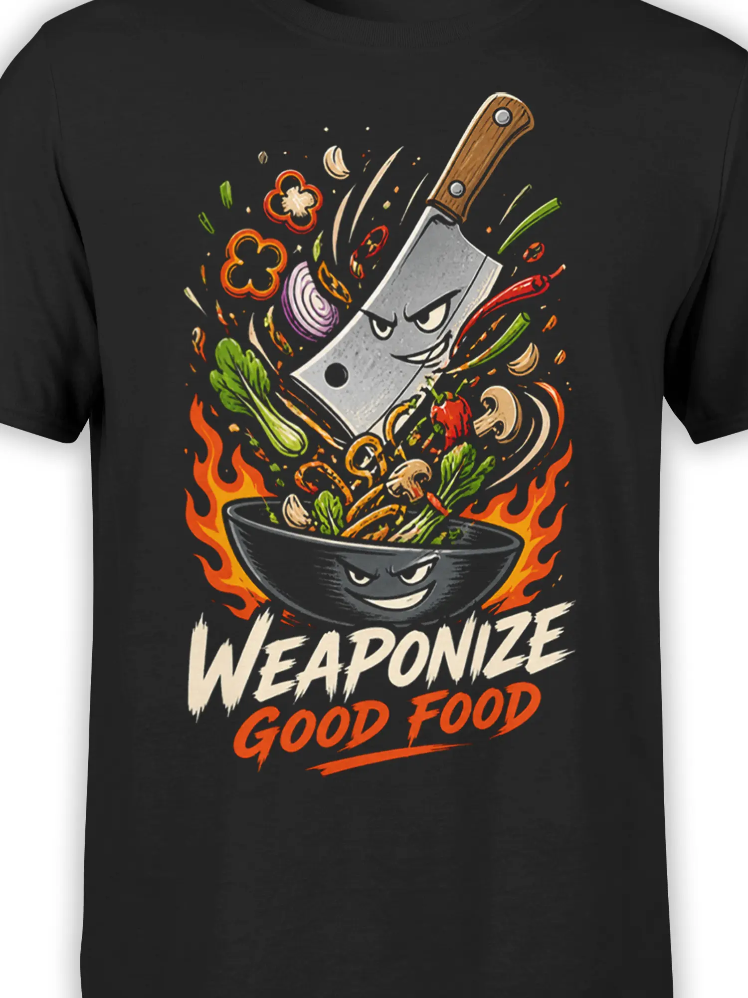 Close-up of the cleaver, grinning bowl, flames, vegetables, and Weaponize Good Food artwork on a black T-shirt