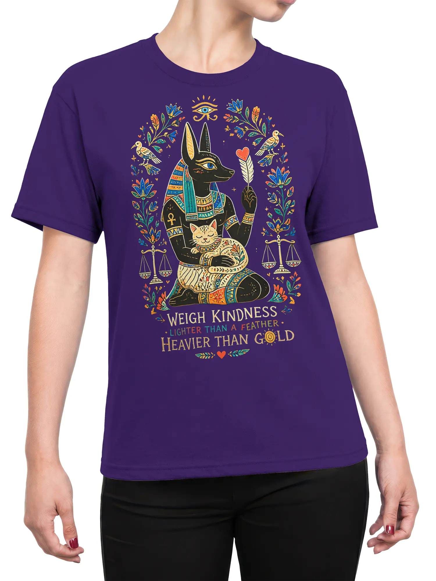 Female torso wearing a purple Egyptian mythology T-shirt with jackal figure, sleeping cat, and kindness design