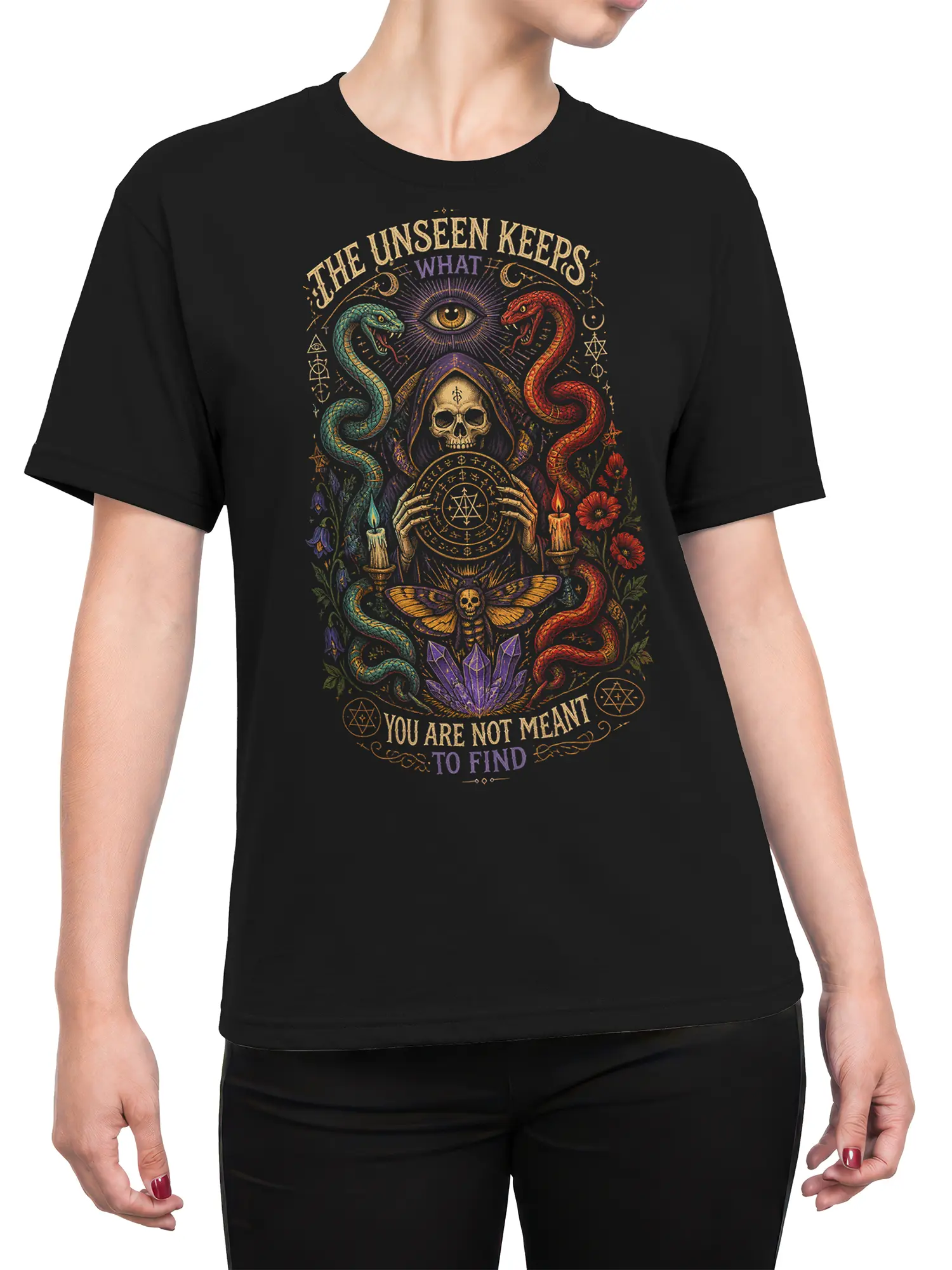 Female torso wearing a black occult T-shirt with twin snakes, a hooded skull, crystals, candles, and mystical artwork
