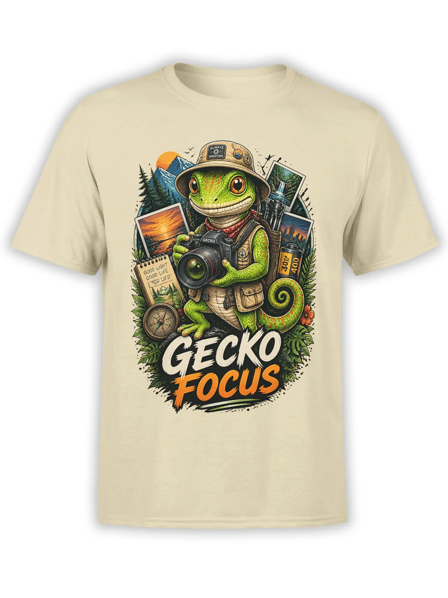 Green gecko photographer holding a camera with mountain scenes and GECKO FOCUS text on a beige shirt